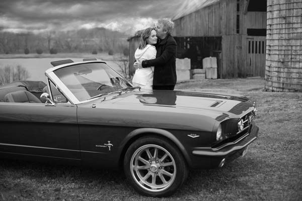 Couple In Front of Their Custom 1965 Mustang