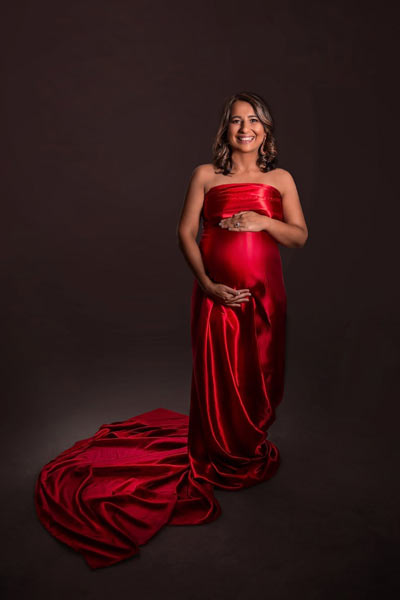 Maternity Boudoir in Red Satin Sheet